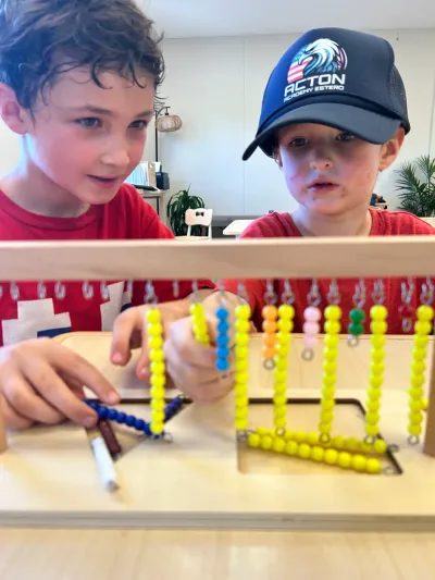Young boy arranging colorful blocks in The Spark Studio